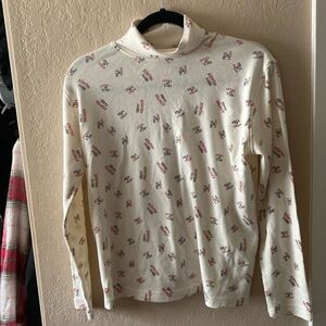 Cream trick or treat turtleneck